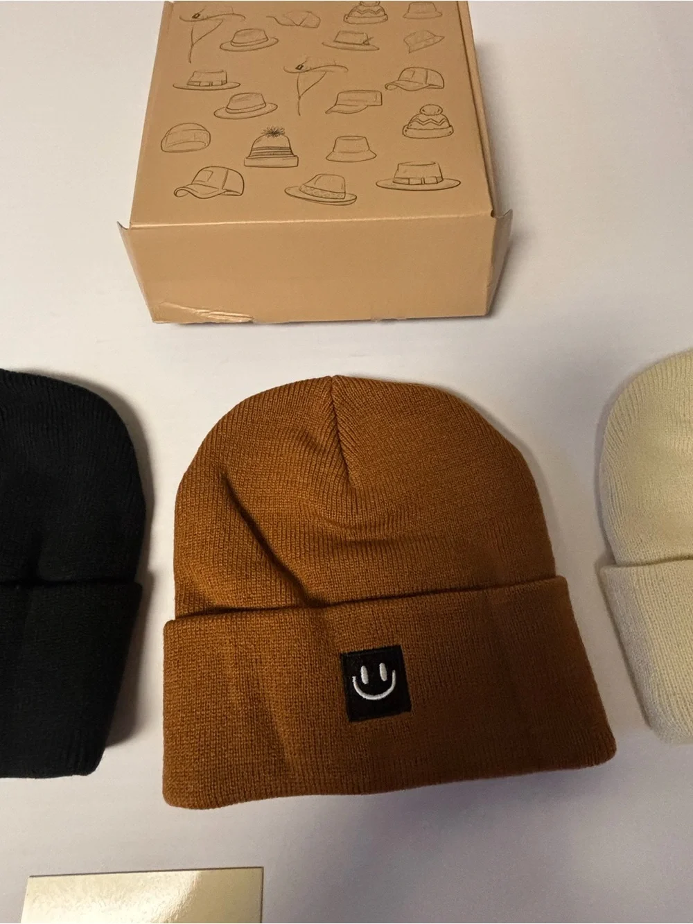 Beanie hats set of three new. Smiley face on front.